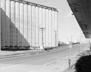 Primary view of object titled '[Grain elevator on S. Main St. in Fort Worth]'.