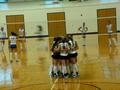 Photograph: [UNT volleyball team huddles during Tulsa match]