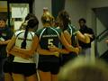 Photograph: [UNT volleyball team huddles during match]