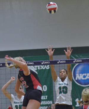 Primary view of object titled '[Jordyn Skinner spikes ball during UNT match]'.