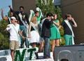 Primary view of [Homecoming Court rides float at 2012 Homecoming Parade]