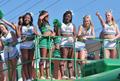 Photograph: [NT Cheerleaders ride float at 2012 Homecoming Parade, closeup 1]