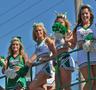 Photograph: [NT Cheerleaders ride float at 2012 Homecoming Parade, closeup 2]