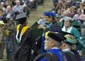 Photograph: [Judith Forney presents Master of Science degree to graduate]