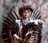 Thumbnail image of item number 1 in: '[An Indigenous American in traditional black and red powwow clothing, 2]'.