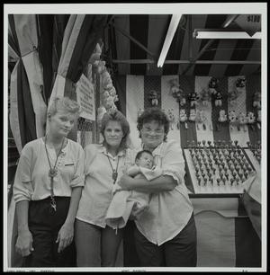Primary view of object titled '[Three women who are working at the state fair]'.