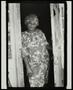 Photograph: [Woman standing in a doorway]