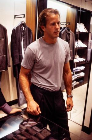 Primary view of object titled '[Mike Modano browsing men's shop for a suit]'.