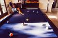 Photograph: [Mike Modano playing pool with a family member]
