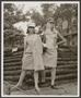 Photograph: [Two women posing in clothing at Six Flags Over Texas]