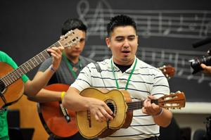 Primary view of object titled '[Student plays vihuela at 2012 Mariachi Aguilitas camp]'.
