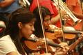 Photograph: [Students play violin at 2013 Mariachi Aguilitas camp]