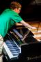 Photograph: [David Falterman tunes piano at CIME/ICEM 2014]