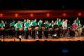 Thumbnail image of item number 1 in: '[Rows of percussionists in green shirts performing onstage, 2]'.