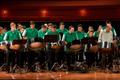 Thumbnail image of item number 1 in: '[Rows of percussionists in green shirts performing onstage, 5]'.