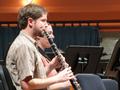 Photograph: [Two people playing clarinets while sitting]