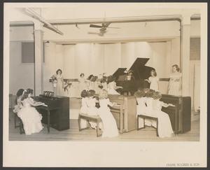 Primary view of object titled '[Little girls practicing the piano]'.