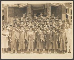 Primary view of object titled '[Graduating class standing in front of the First Baptist Church]'.