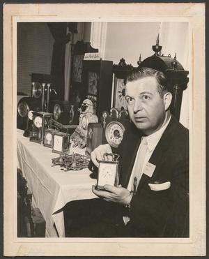 Primary view of object titled '[Photograph of a man with clocks]'.