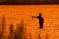 Photograph: [Serene Sunset Serenade: Angler's Haven on Lake Amistad]