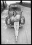 Thumbnail image of item number 1 in: '[Man Posing in Front of a Beetle]'.