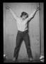 Photograph: [Woman with her Arms Raised in a Photography Studio]