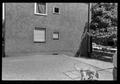 Photograph: [Dog in front of an apartment]