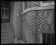 Photograph: [Building with a patterned brick wall]