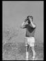 Photograph: [Man holding binoculars]