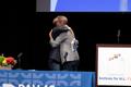 Photograph: [Chad West and Robert Emergy hugging, 2]