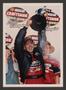 Photograph: [Greg Biffle posing with the NASCAR Craftsman Truck Series trophy]