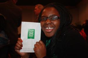 Primary view of object titled '[Smiling Student with UNT "Four Bold Goals" Pamphlet]'.