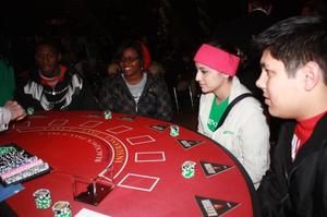 Primary view of object titled '[Four UNT Students at Red Poker Table]'.