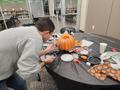 Photograph: [Kristian Enbysk decorating a pumpkin, 2]