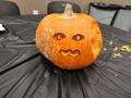 Photograph: [A face carved on a pumpkin]
