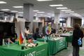 Photograph: [UNT libraries setting up tables for Pride Week]