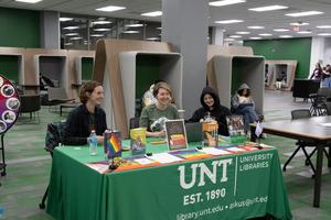 Primary view of object titled '[UNT library staff and faculty laughing together]'.