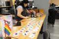 Photograph: [Spark employee preparing designs for button making]