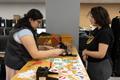 Photograph: [Spark employee helping a student with button making]