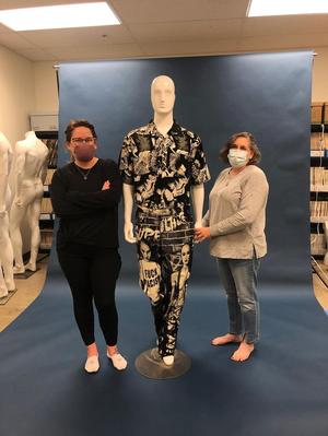 Primary view of object titled '[Megan Desoto and Janelle McCabe standing next to a mannequin]'.