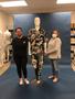 Photograph: [Megan Desoto and Janelle McCabe standing next to a mannequin]