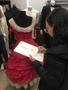 Photograph: [Student sketching a dress from a mannequin]