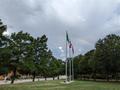 Photograph: [A rainbow above the flag poles at Willis Library]