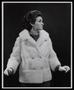 Photograph: [A woman posing in a double-breasted fur coat]