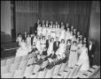 Photograph: [A Capella Choir Posing for a Photograph in the Corner of the Auditor…