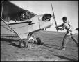 Thumbnail image of item number 1 in: '[Two Aviators Preparing for Flight]'.