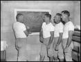 Primary view of [Football Coaches with Blackboard]