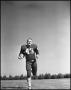 Photograph: [Football Player Number 43 Running on a Field]