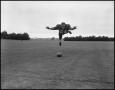 Photograph: [Football Player No. 64 in Midair, September 1962]