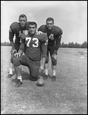 Primary view of object titled '[Three football players]'.